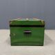 Green metal trunk with wooden sleds