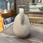 Unfired clay pitcher