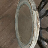 Patinated oval mirror