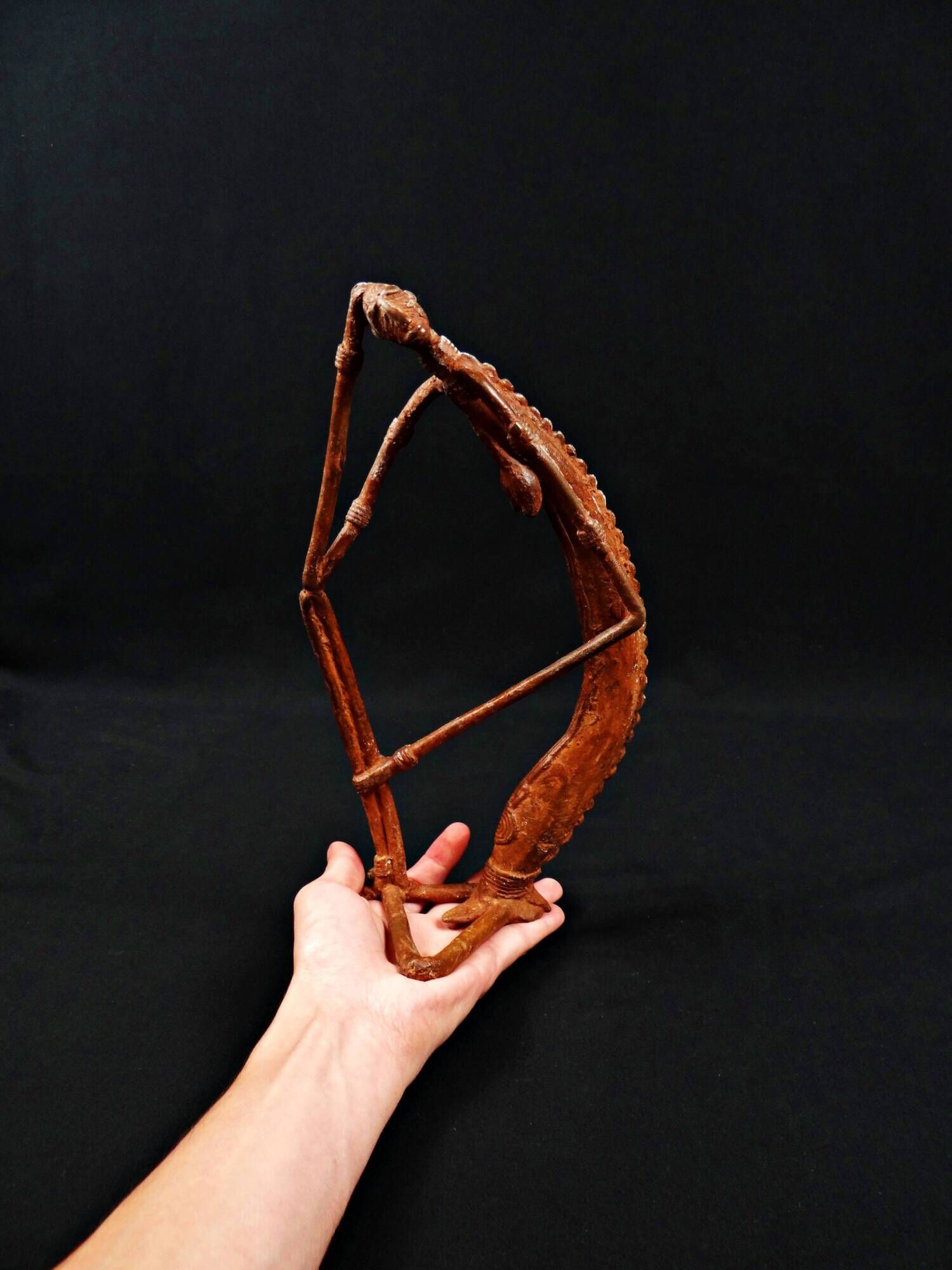 Dogon Nommo bronze statue with brown patina and red highlights, mid-20th century
