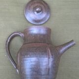 Teapot and ceramic cup signed JP