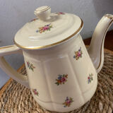 Old teapot or coffee maker in English style.