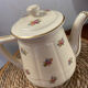 Old teapot or coffee maker in English style.