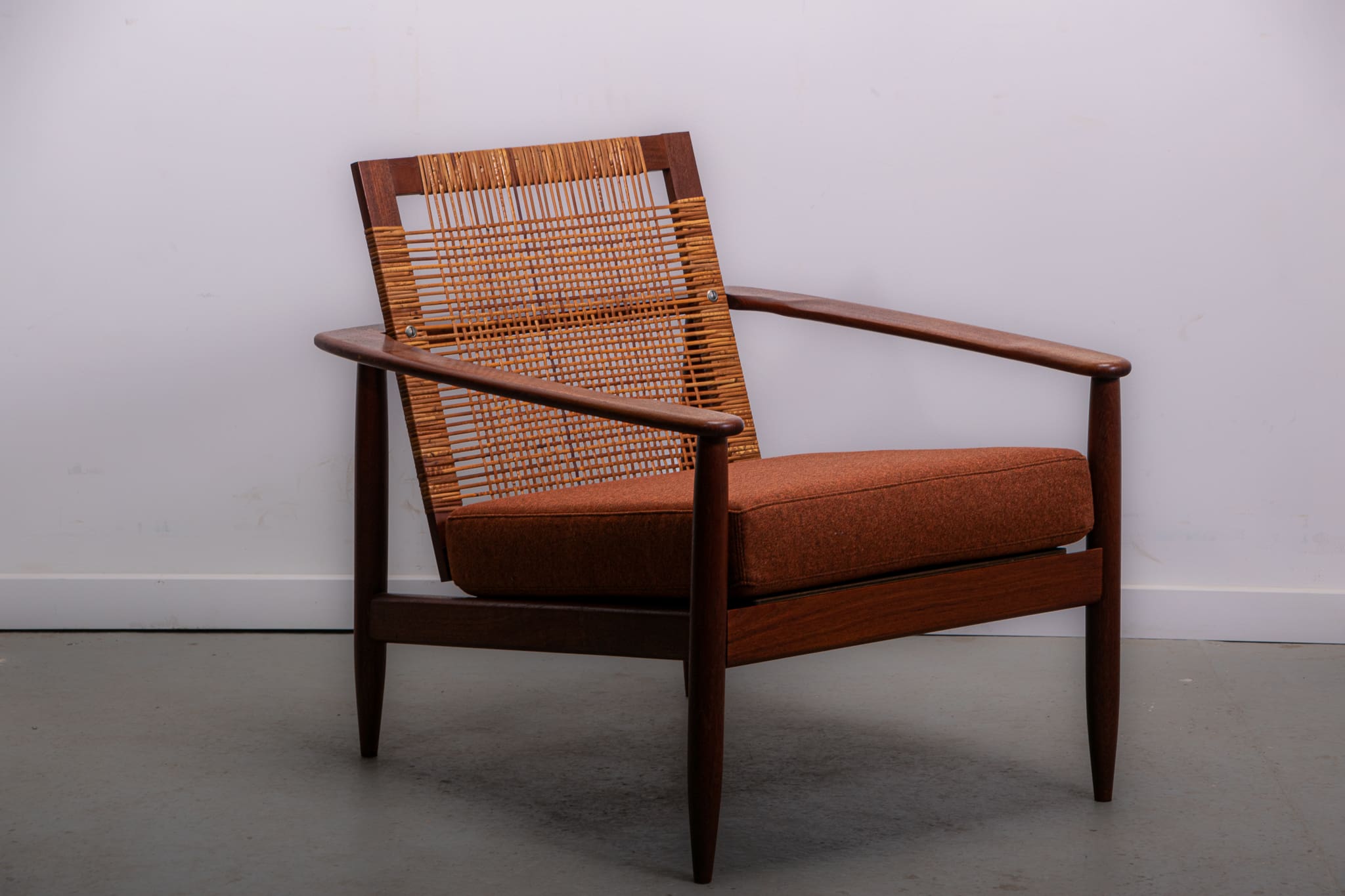 Mid-century easy chair in teak and cane circa 1970