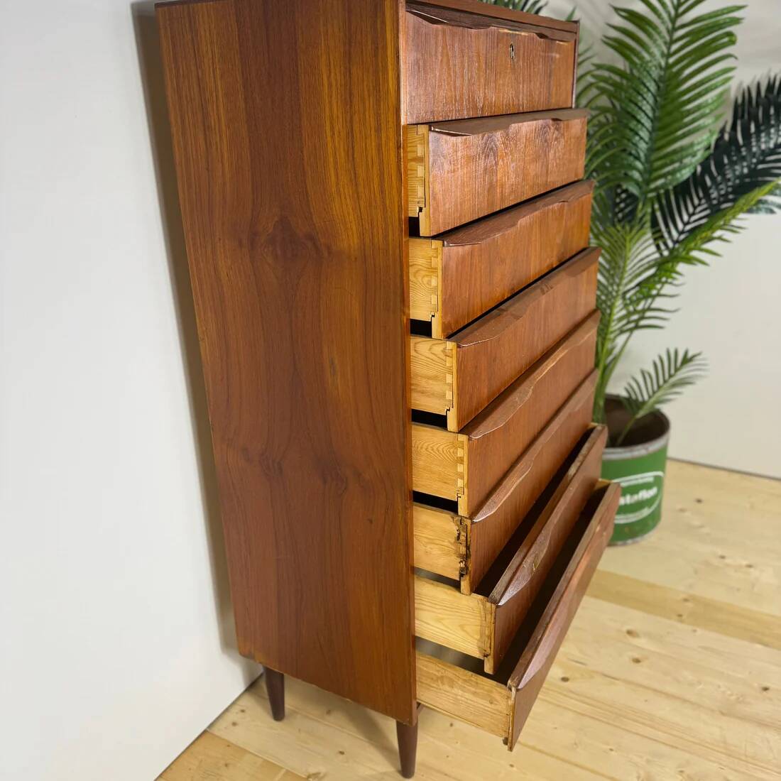 Mid-century Danish high chest of drawers with eight teak drawers.