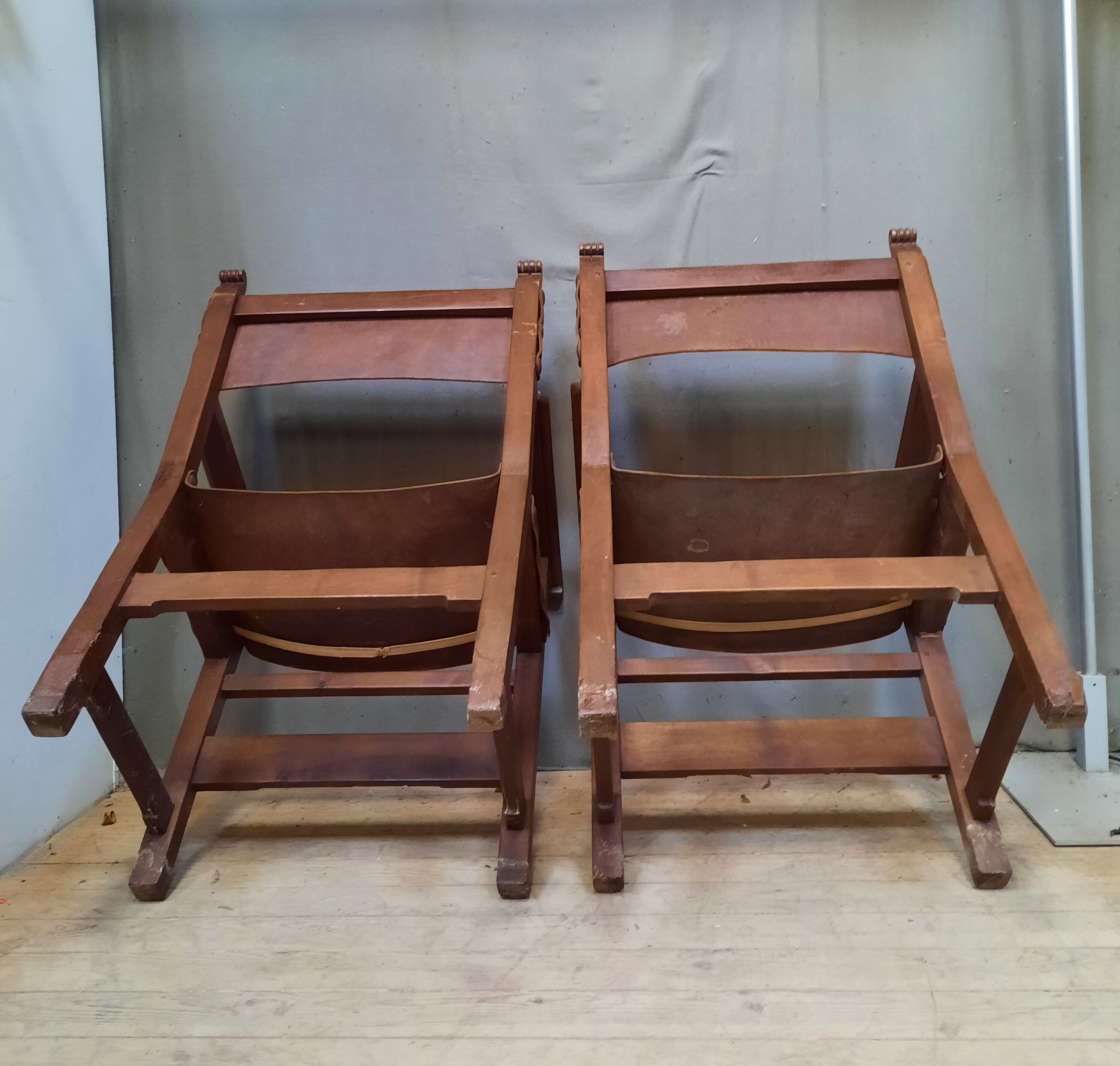 Pair of medieval leather style armchairs