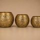 Set of 3 handmade brass candle holders with an openwork pattern.