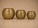 Set of 3 handmade brass candle holders with an openwork pattern.