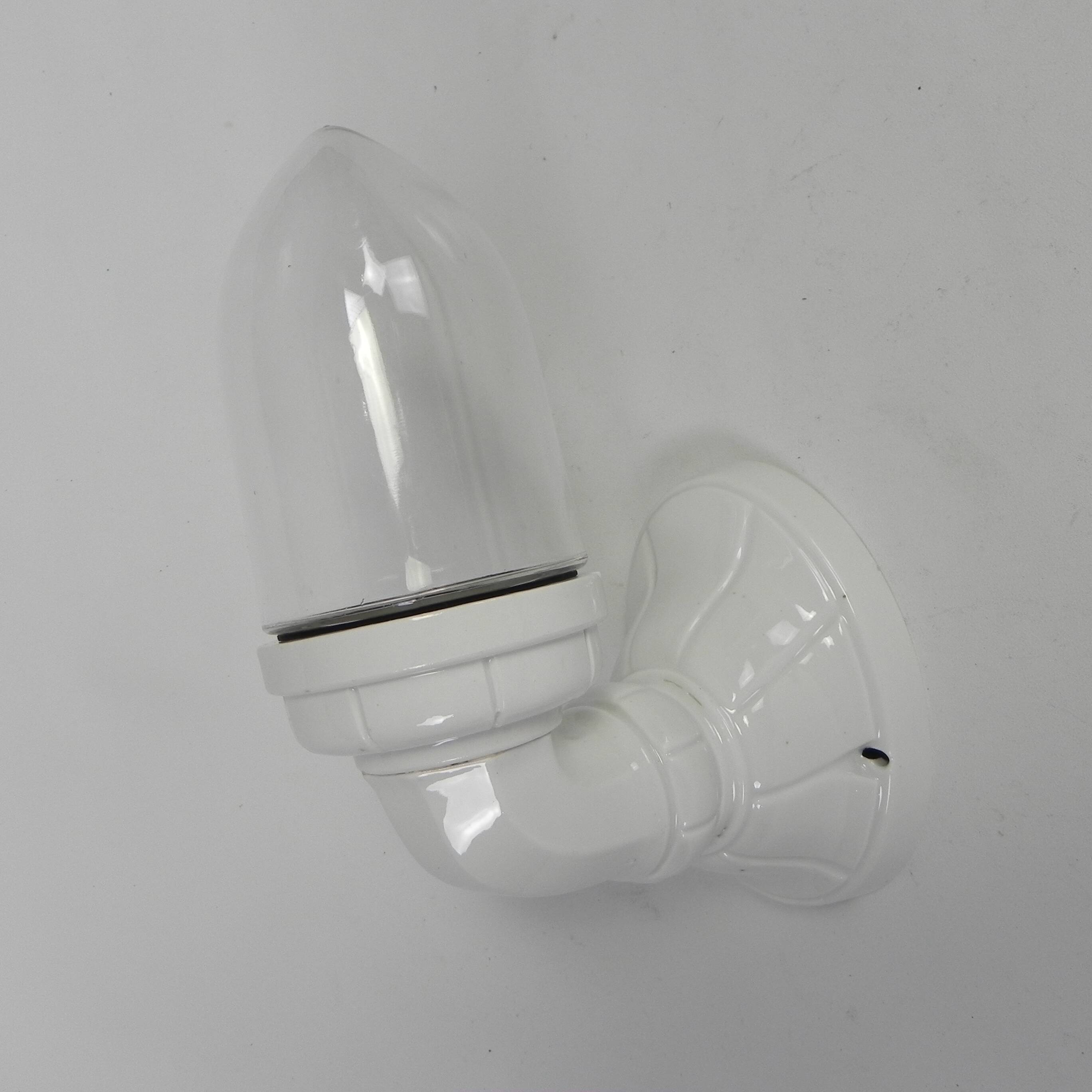 Wall lamp in porcelain with a transparent glass shade, 1930s.