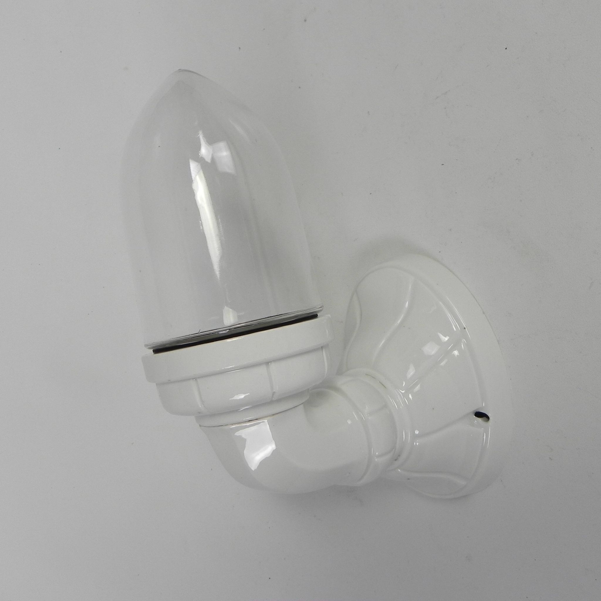 Wall lamp in porcelain with a transparent glass shade, 1930s.