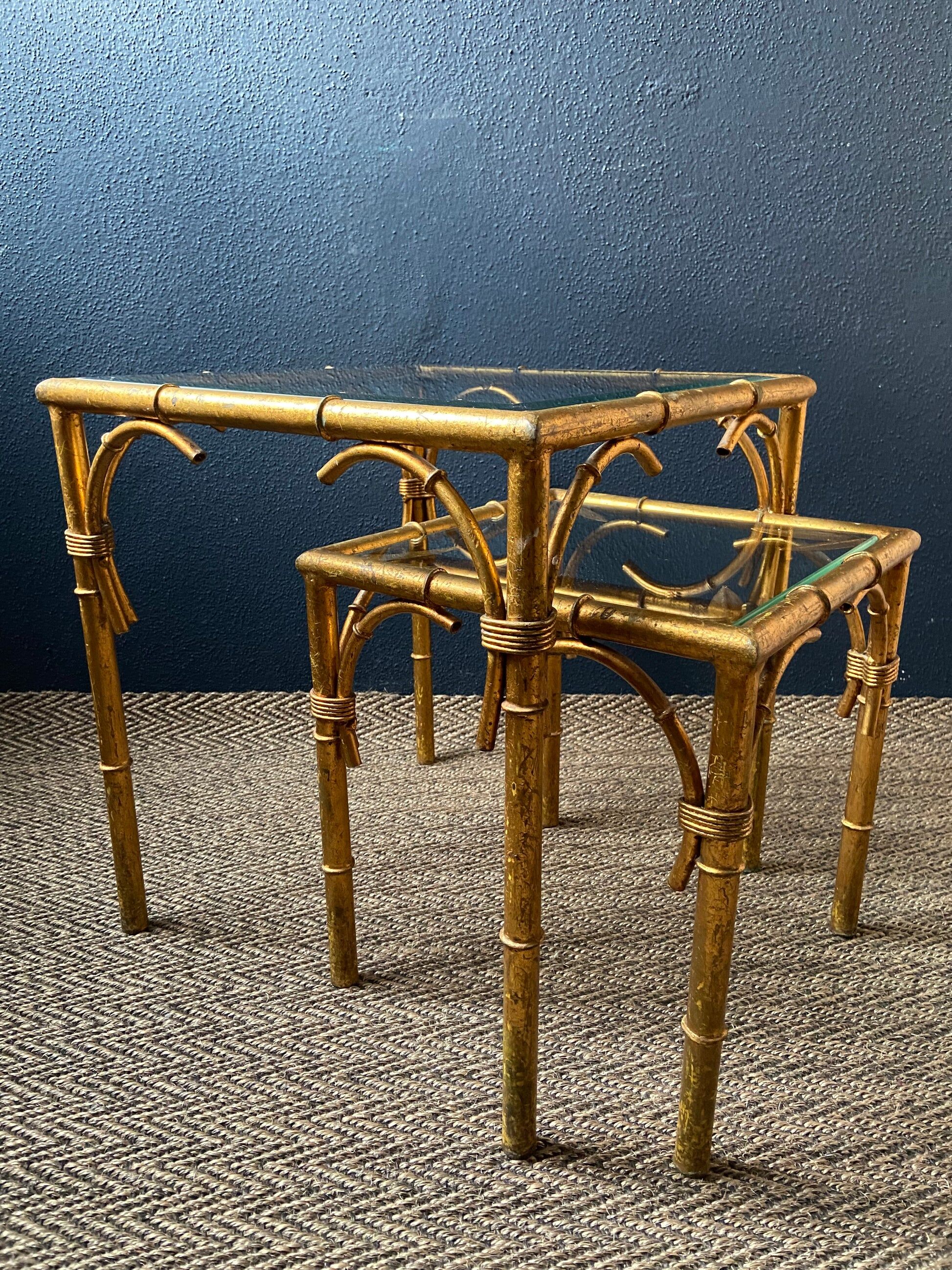 Pair of nesting tables in faux bamboo with glass tops, France, 1960s.