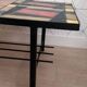 Vintage coffee table in ceramic, wood, and metal.