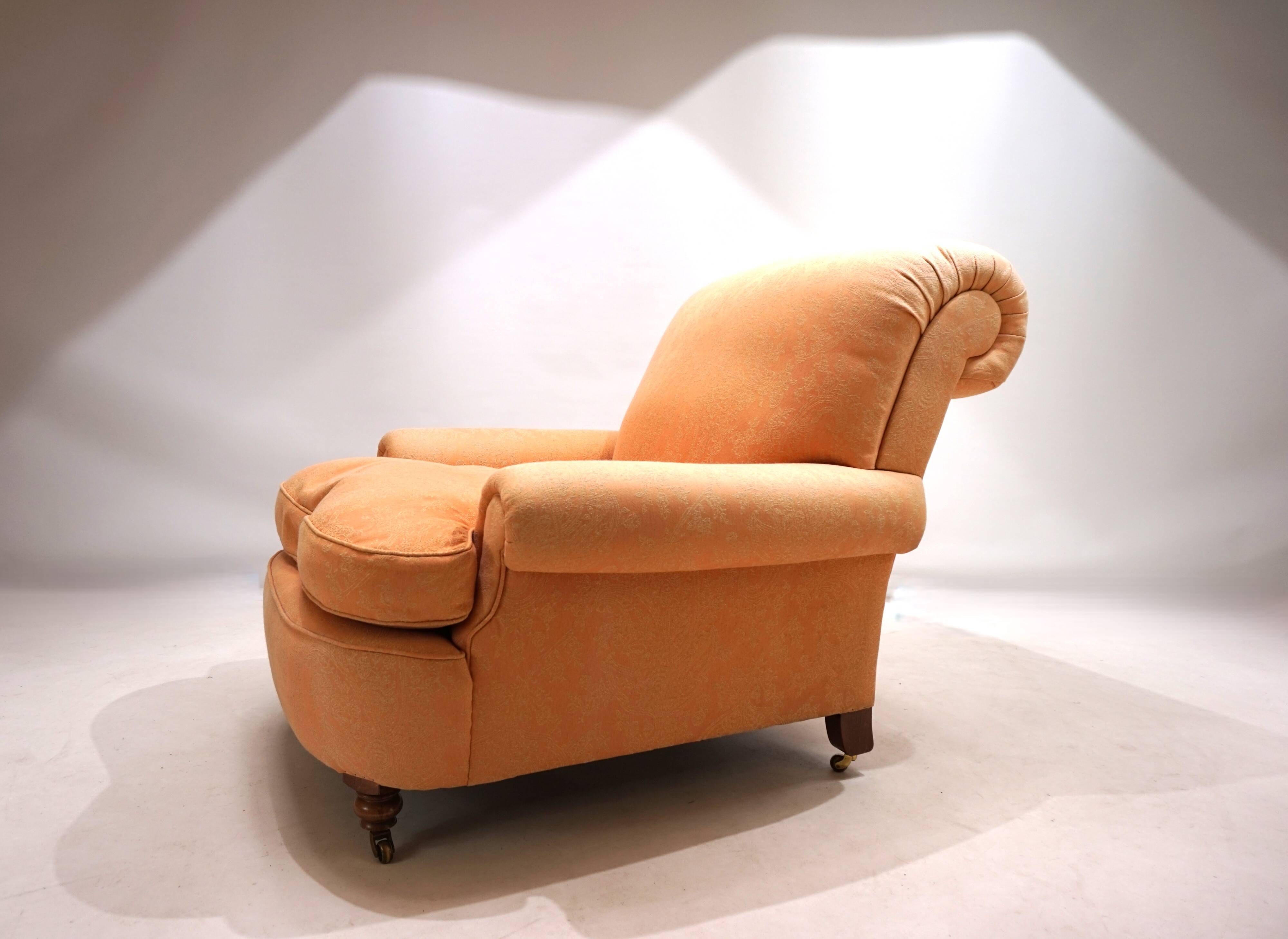 Deep seated armchair in the style of Howard & Sons
