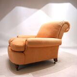 Deep seated armchair in the style of Howard & Sons