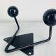 Pair of wall hooks from the 1950s, black metal