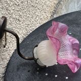 Metal wall lamp with frosted glass shade in the shape of a pink corolla