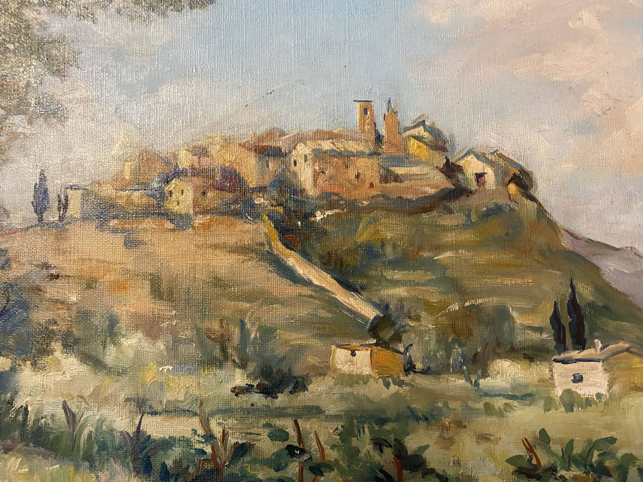 A painting representing a village in Tuscany.