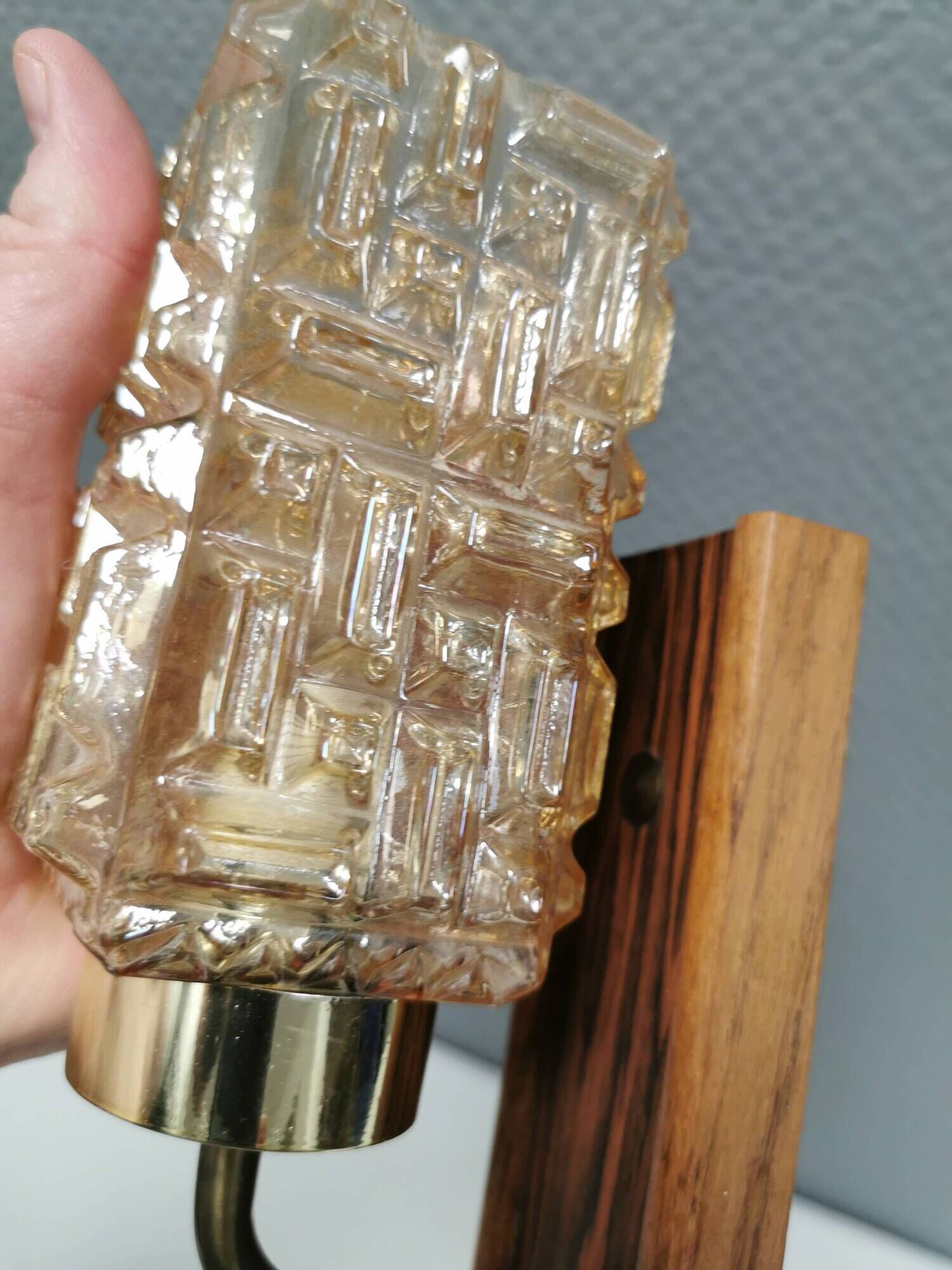 Small, stylish wall lamp with rosewood suspension and hard pressed glass