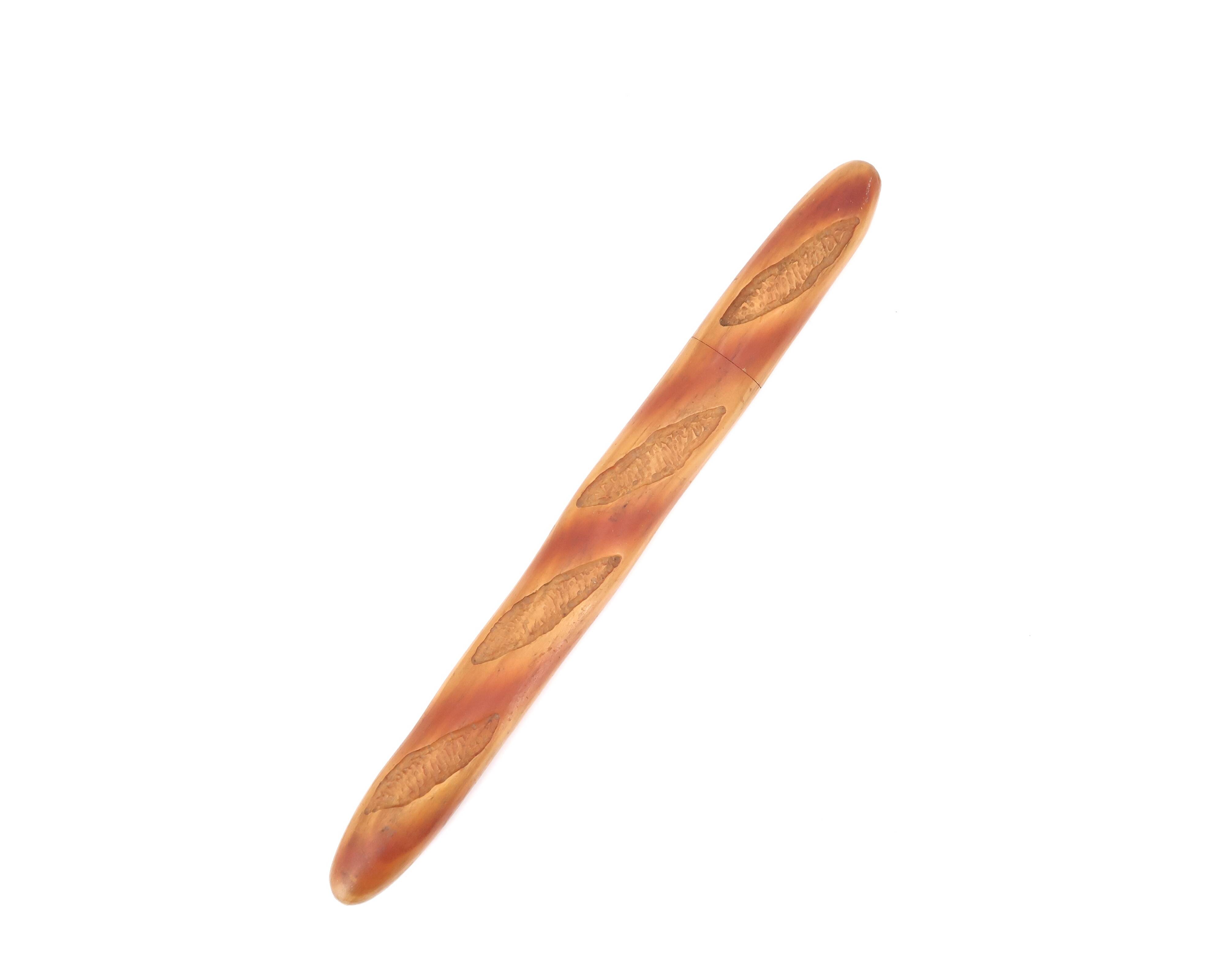 Bread knife in the shape of a wooden and stainless steel baguette