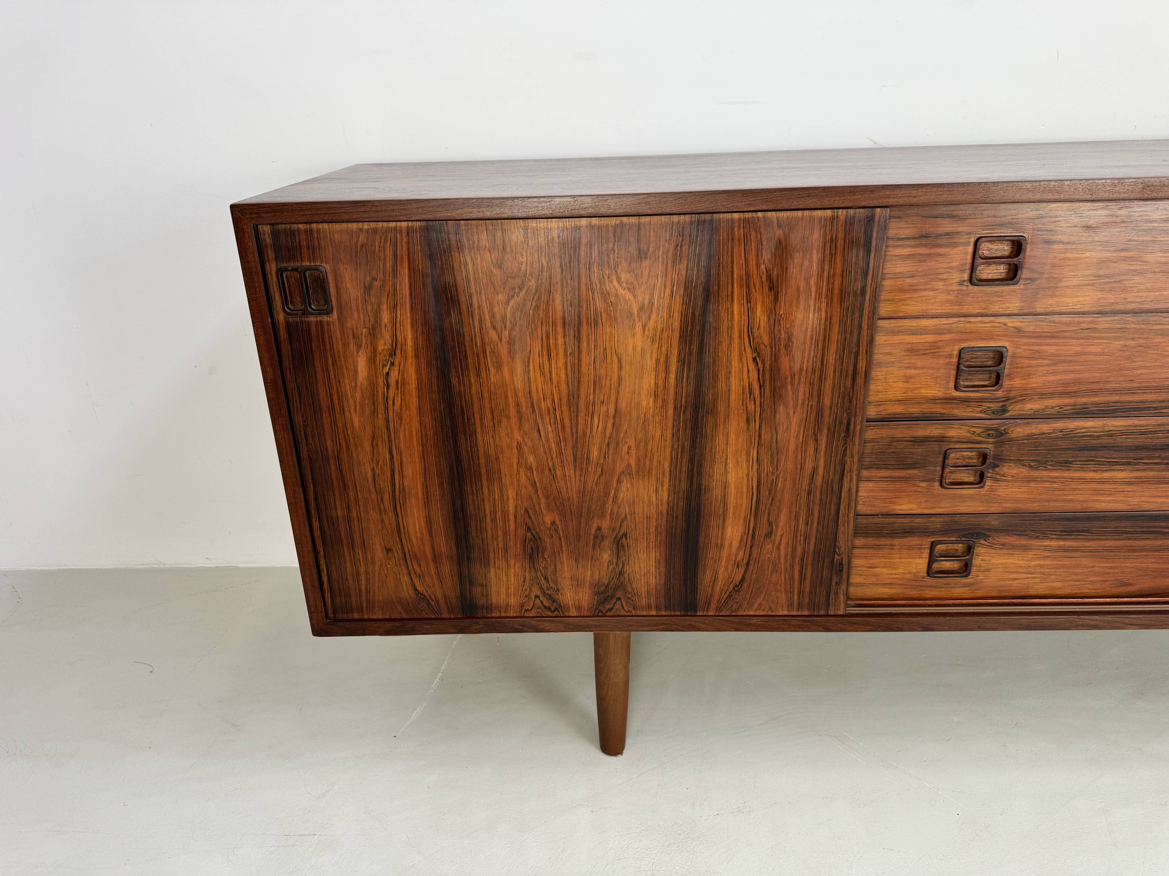 Danish rosewood vintage sideboard with sliding teak doors from the 1960s