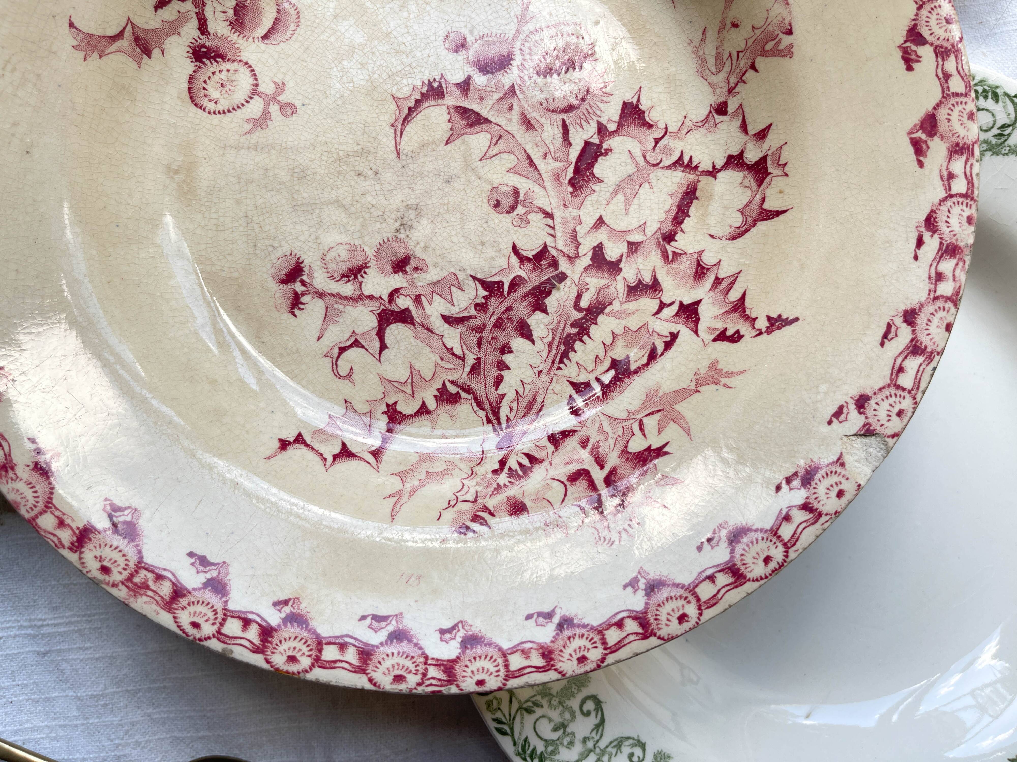 10 mismatched vintage soup plates in blue, green, and red ironstone