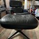Black leather Eames Vitra armchair, original with rosewood ottoman.