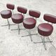 Set of 4 Mid Century Modern swivel chairs in tubular steel and leather.