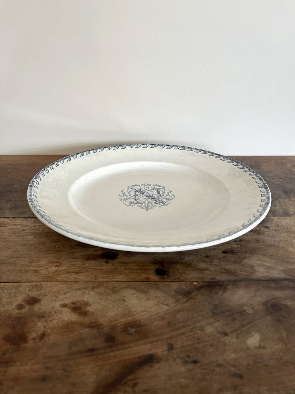 Round iron earth dish monogram “N” KG Lunéville