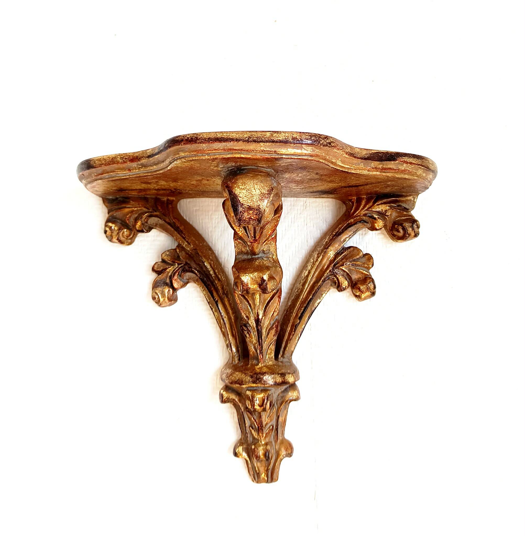 Golden wood wall console in Louis XV style.