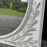Louis XVI style fireplace mirror, carved wood trumeau with white and grey highlights, 18th century