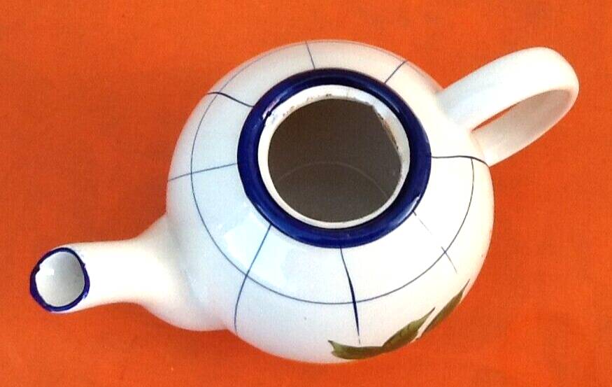 Coffee / teapot ball shape earthenware with fruit decoration