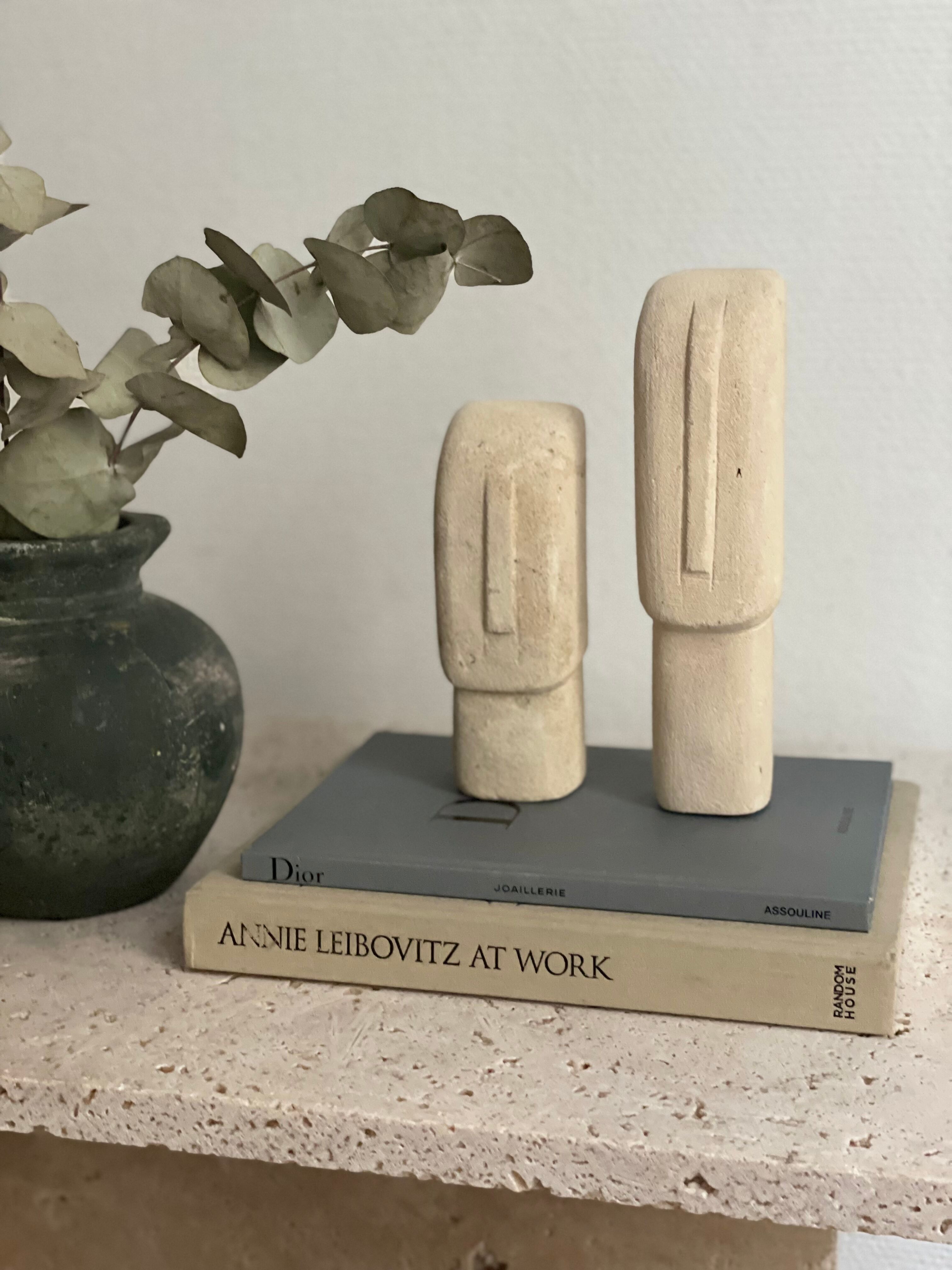 Set of two minimalist stone face statues