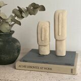 Set of two minimalist stone face statues
