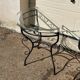 Glass and iron table with two side tables and 8 chairs