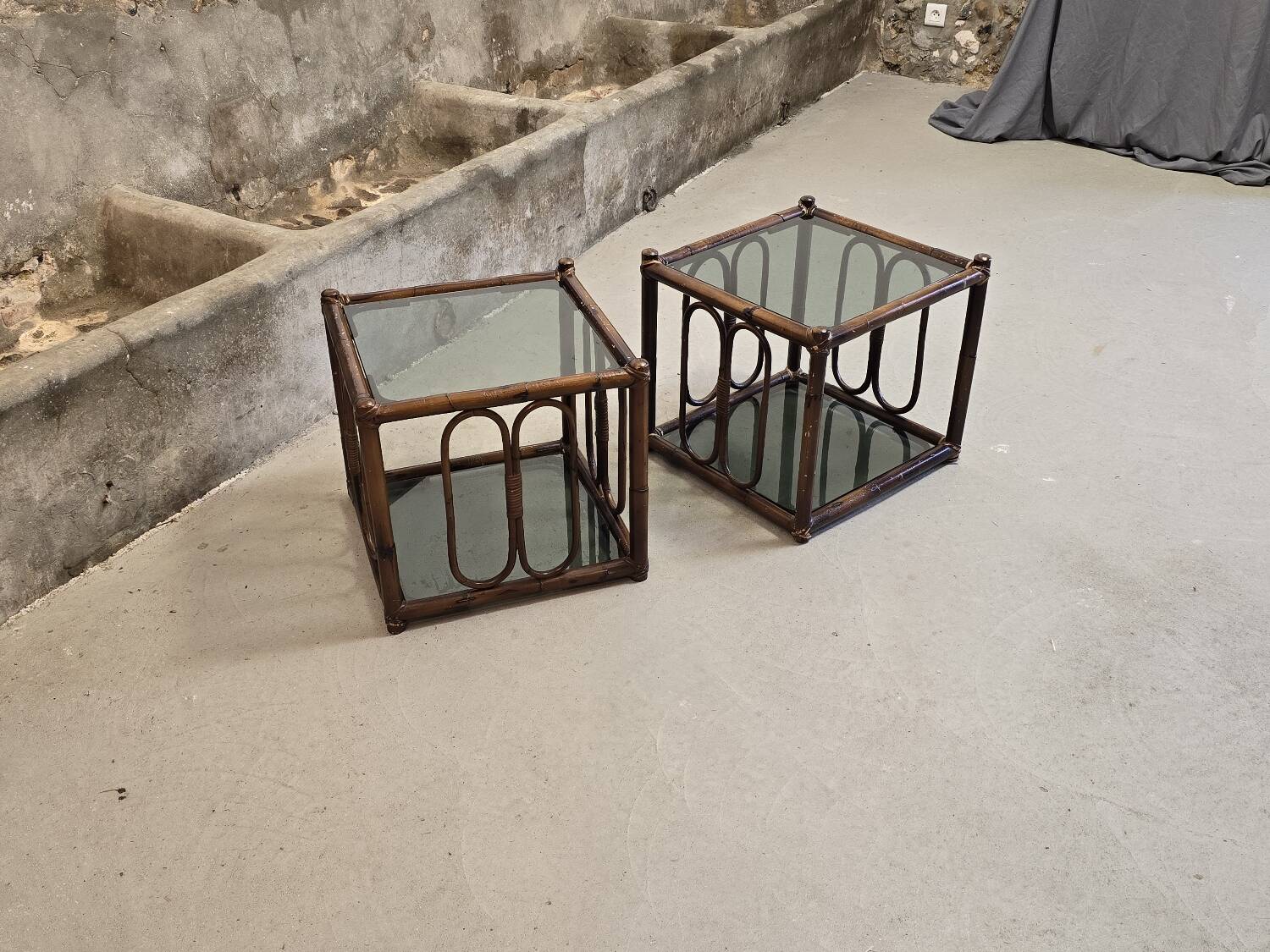 Two rattan and smoked glass tables, 1970