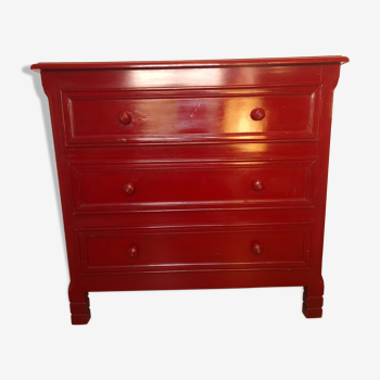 Vintage red chest of drawers in exotic wood