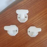 Trio of white porcelain hooks