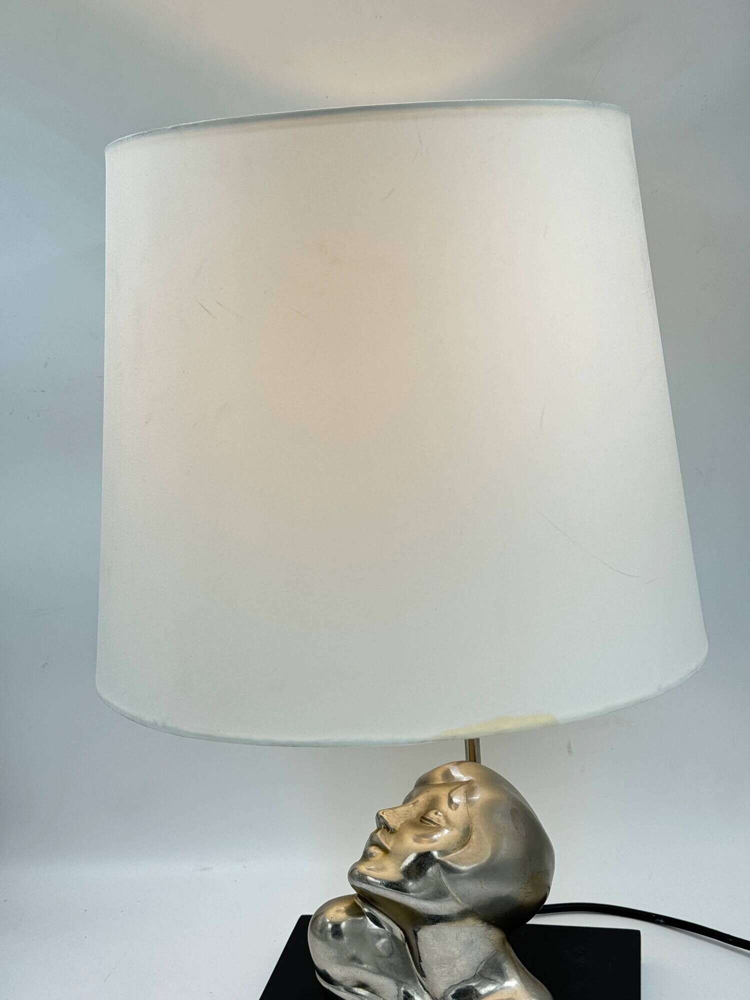 Vintage Art Deco style table lamp, face sculpture, silver-toned bust.