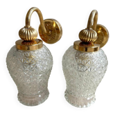 Set of two vintage gold wall sconces with glass tulip globes.