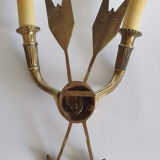 Vintage wall lamp decorated with bronze arrows