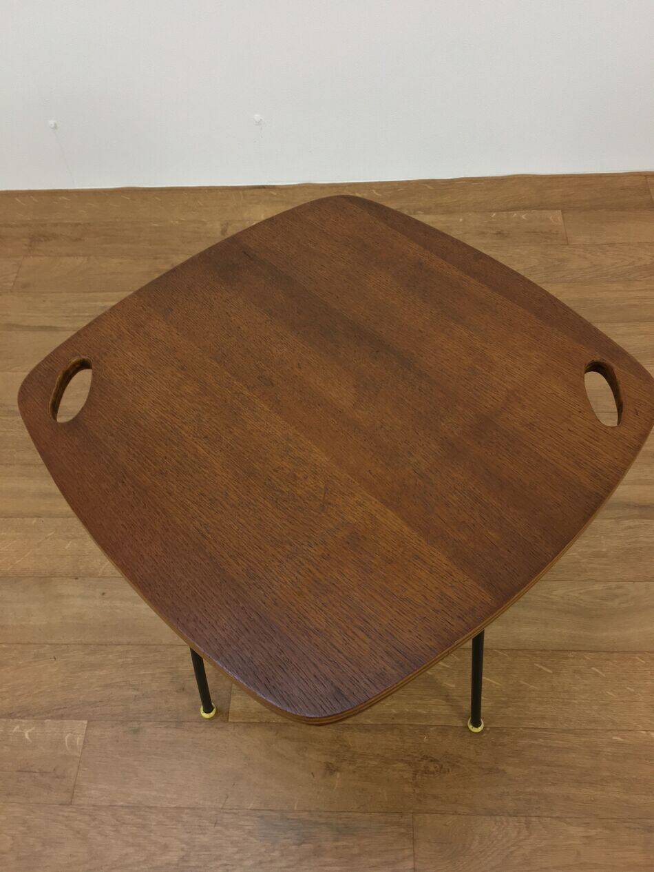 Modernist side table, 1950s, wood and metal, with handles.