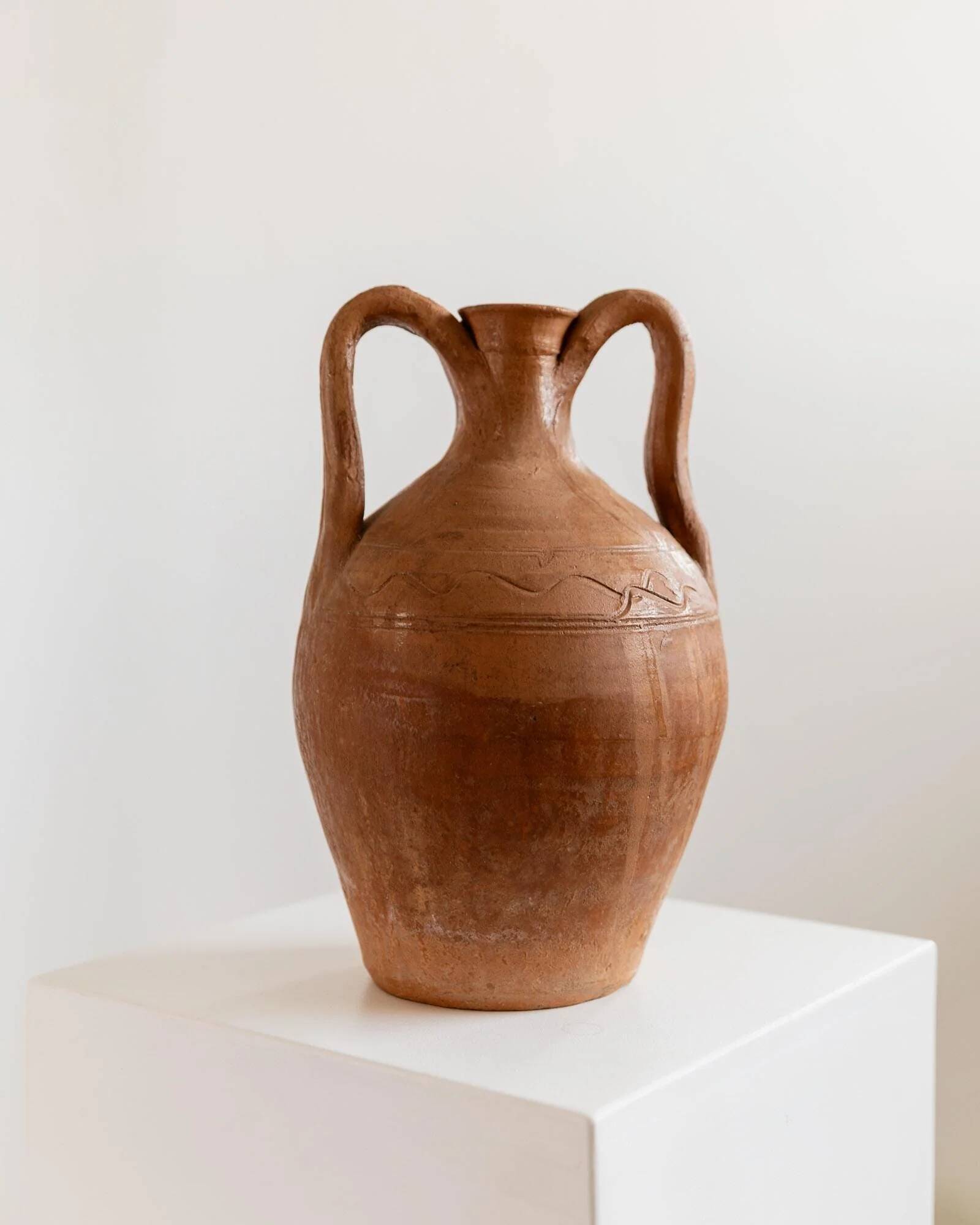 Vintage terracotta amphora vase from the early 19th century, handmade Italian jug with two handles.