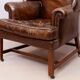 Wingback armchair in dark brown patinated leather, 1970s