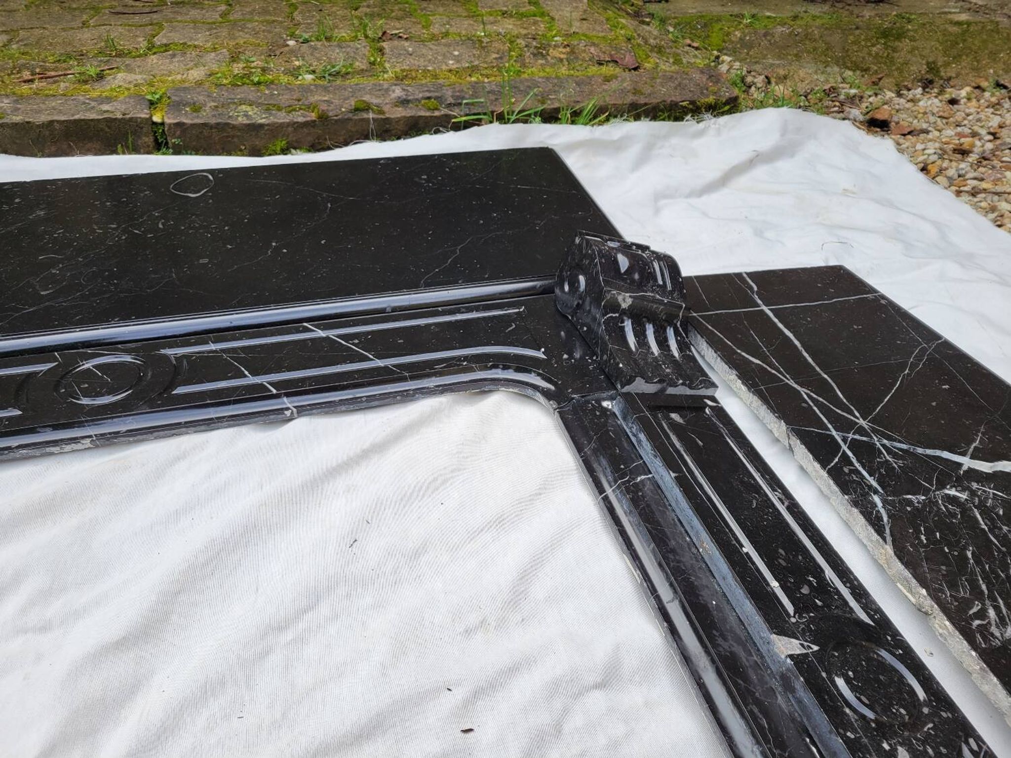Pompadour fireplace with black marble modillions