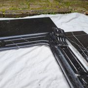 Pompadour fireplace with black marble modillions