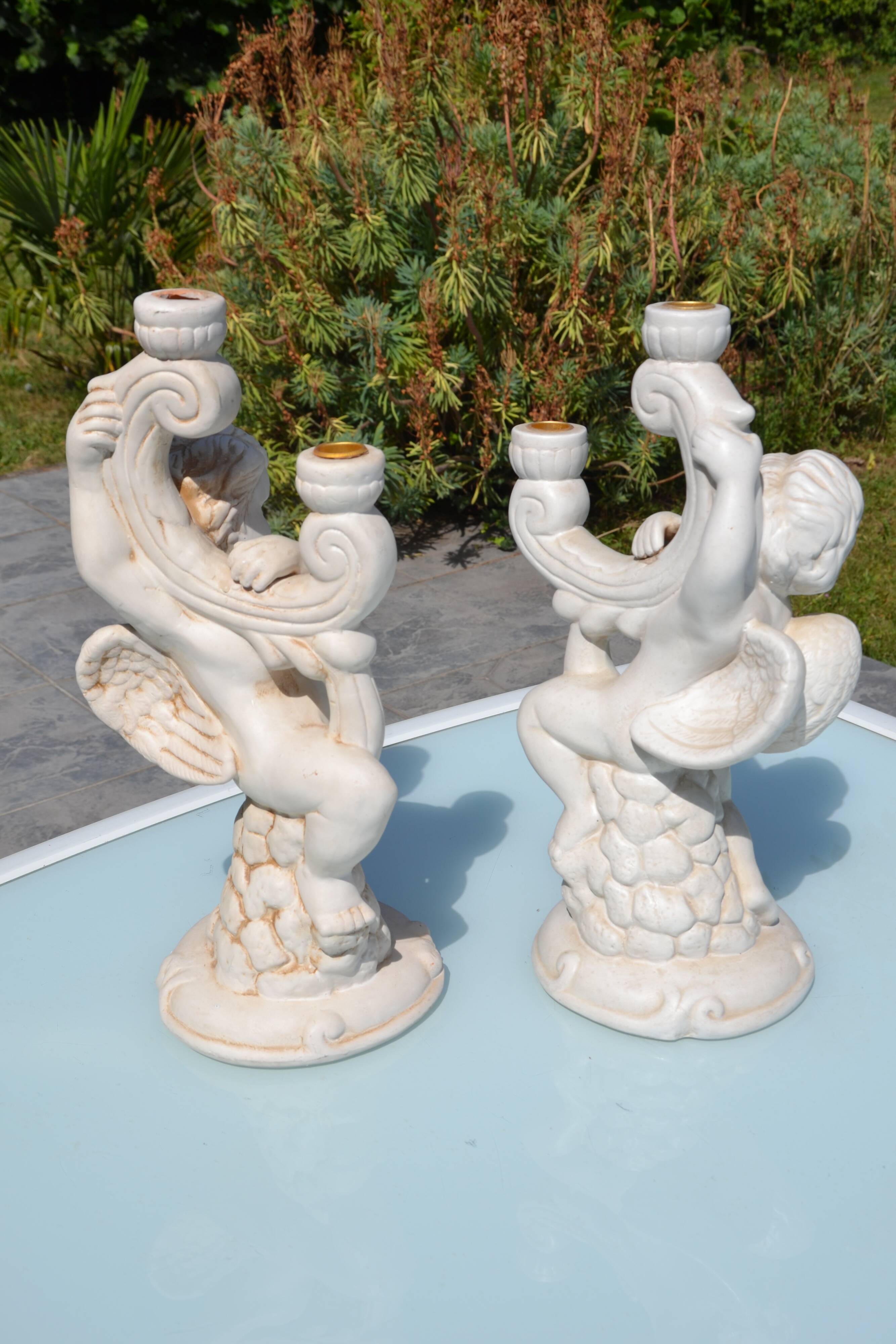 Pair of "cherub" candle holders in plaster