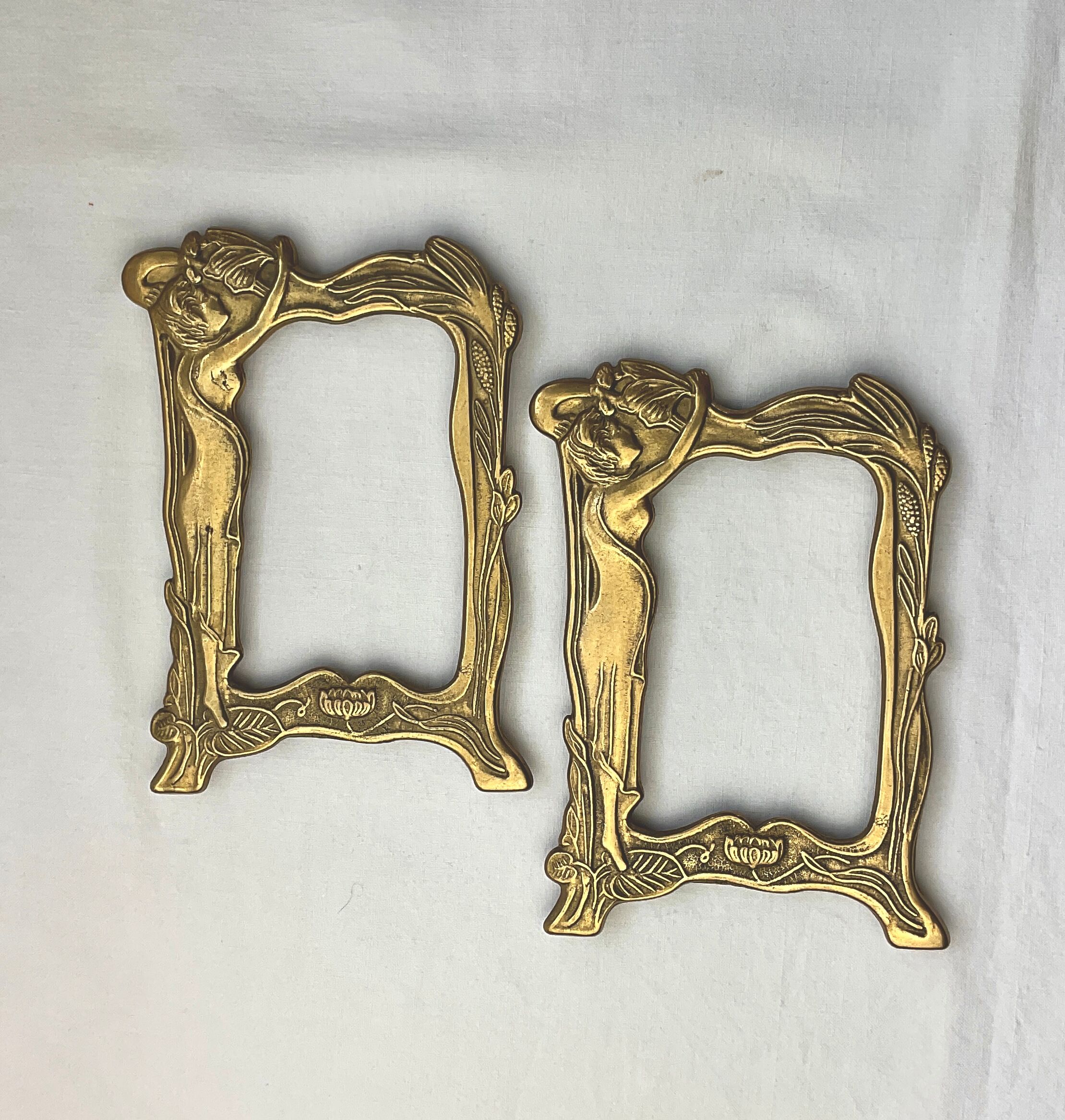 Pair of brass frames with Art Nouveau style woman