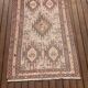 Hand-knotted silk carpet purchased in Iran – geometric and animal design –