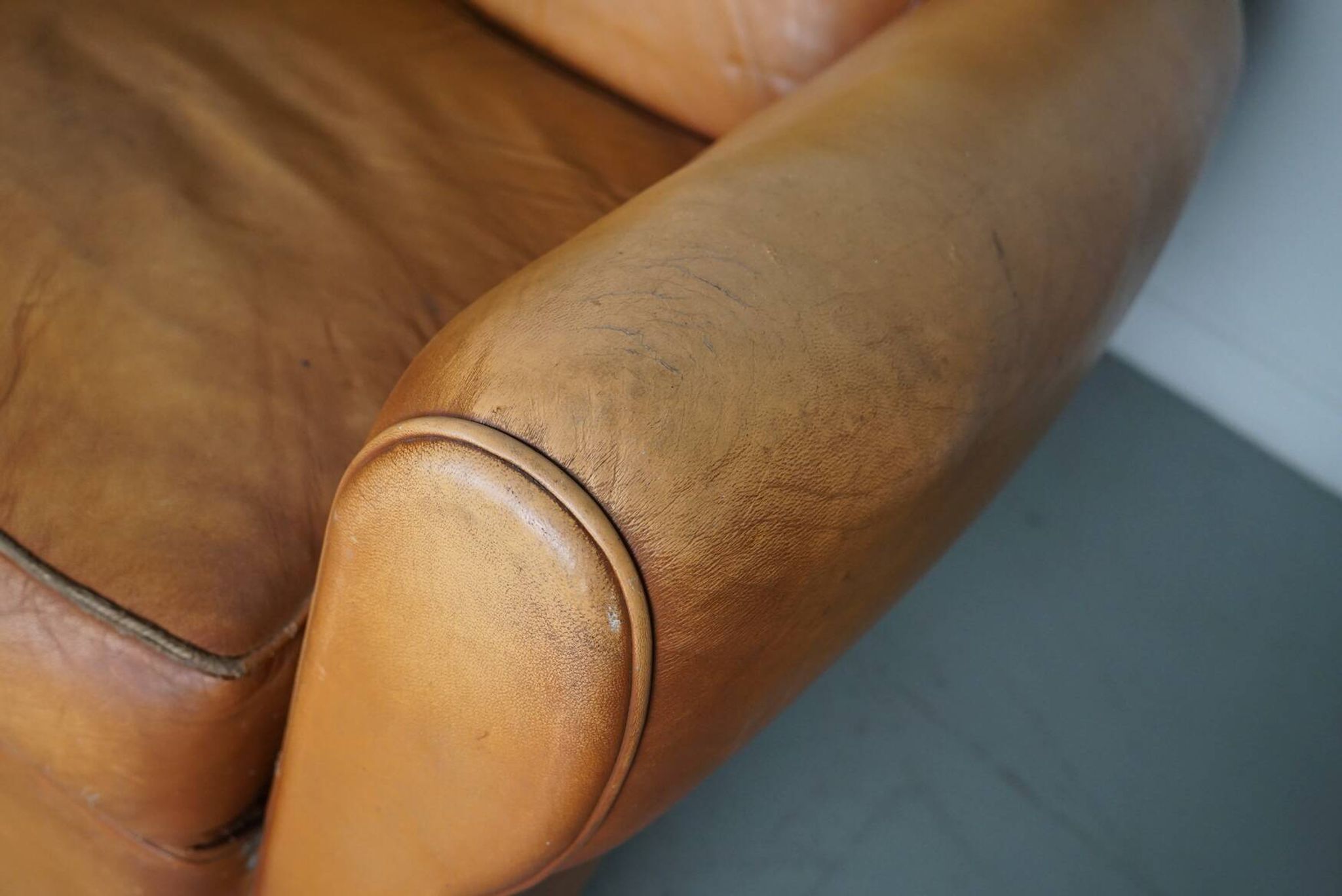 Pair of French Cognac Moustache Back Leather Club Chairs, 1950s