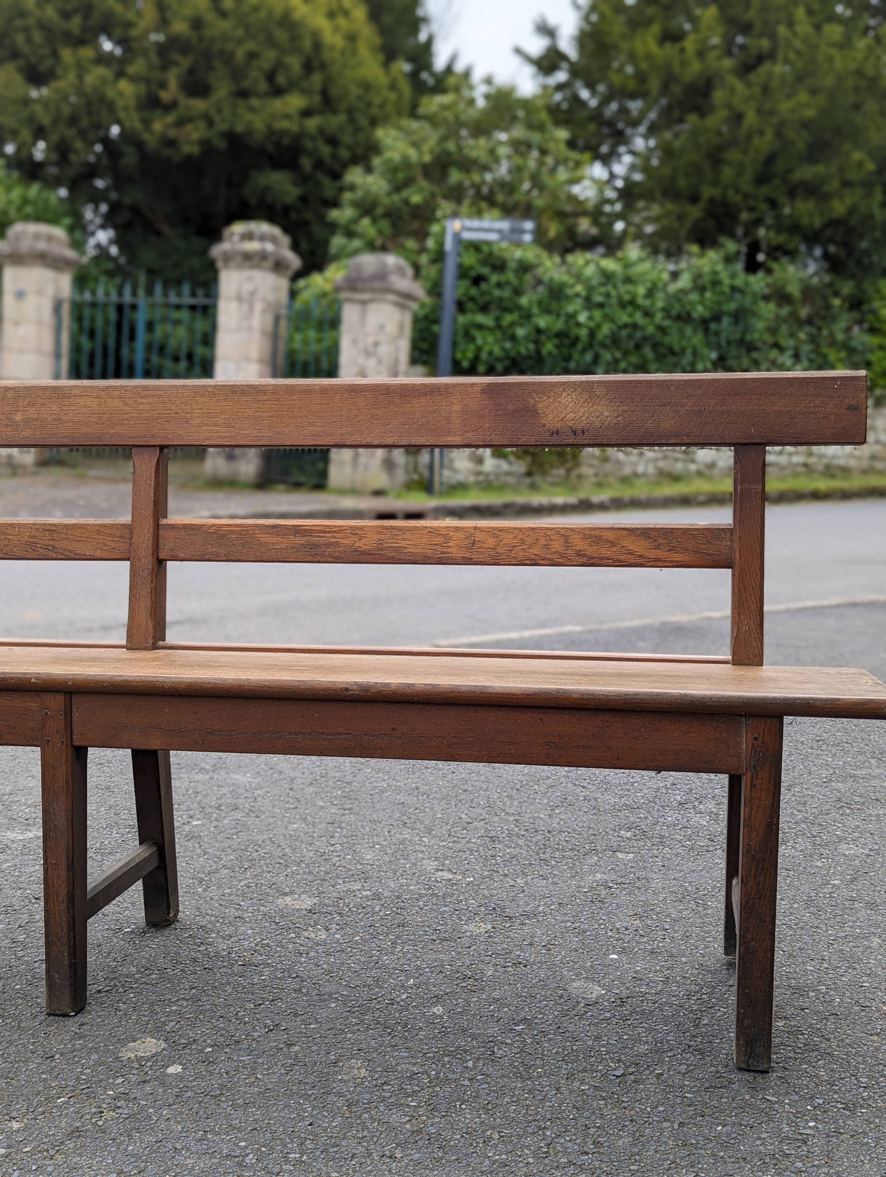 Large oak bench with back